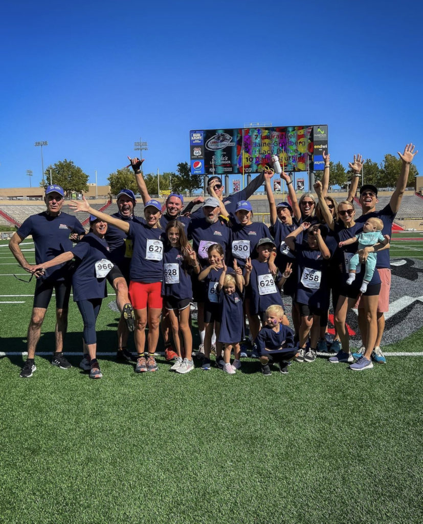 Group photo of Blake's team with their kids