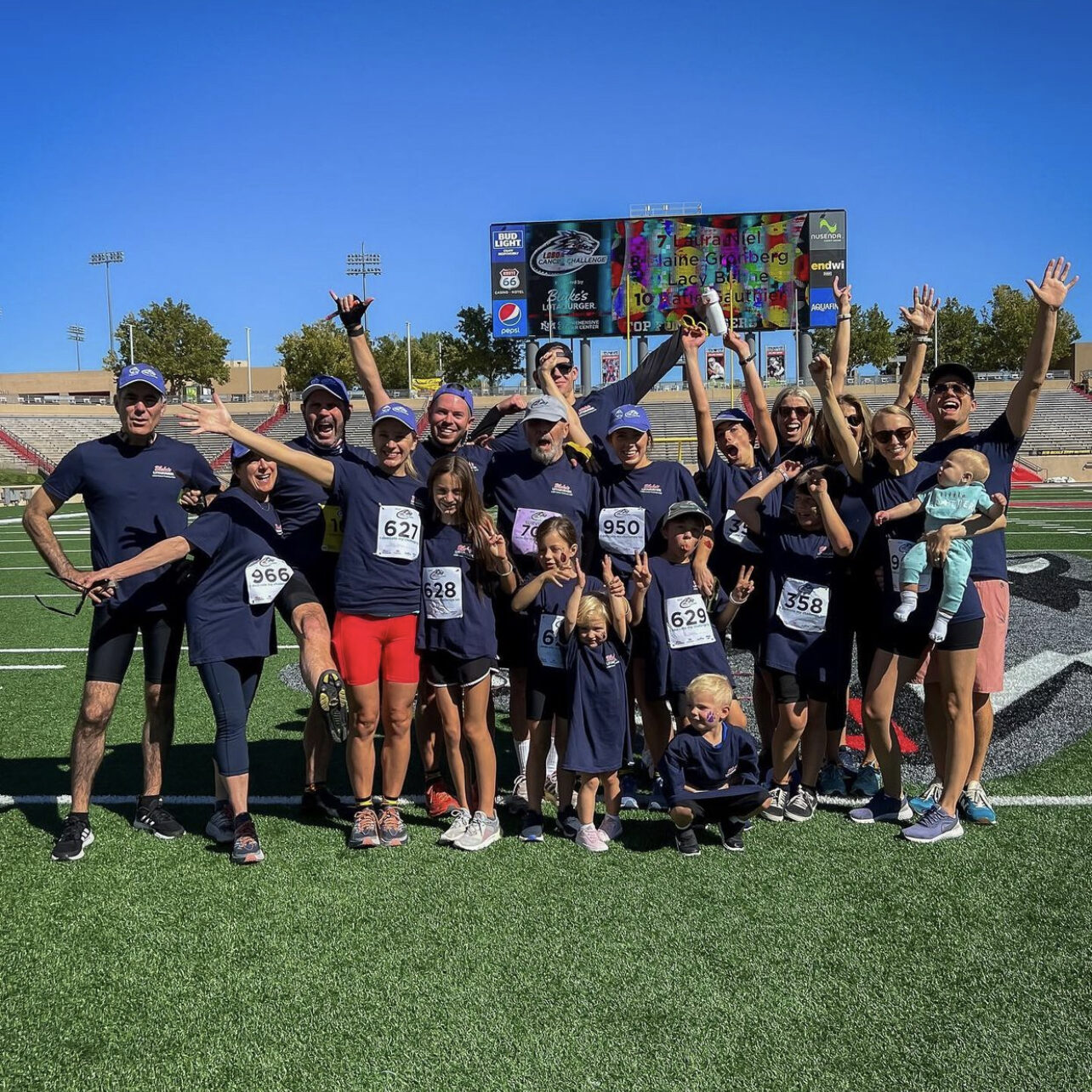 Group photo of Blake's team with their kids