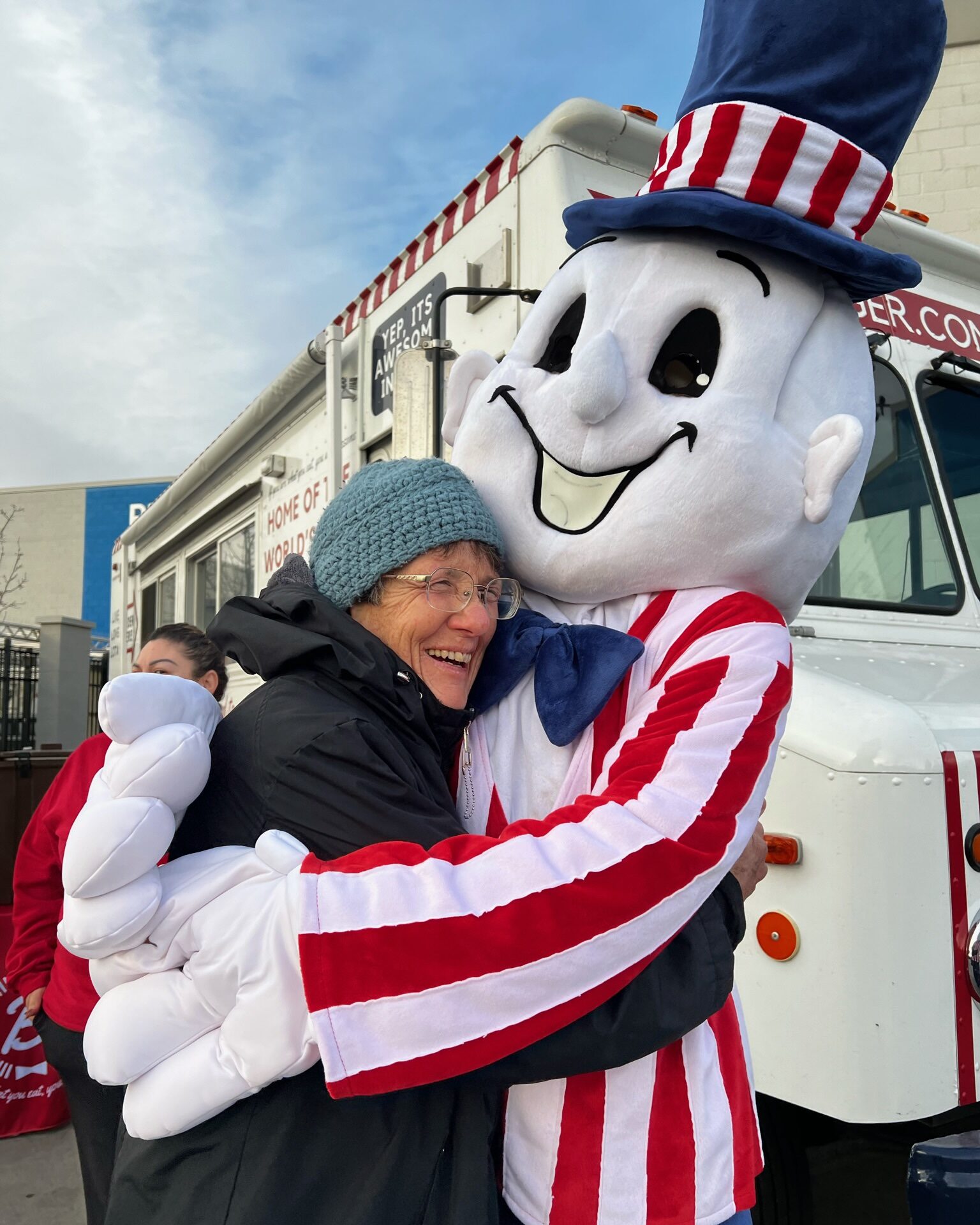 Blake's mascot hugging someone