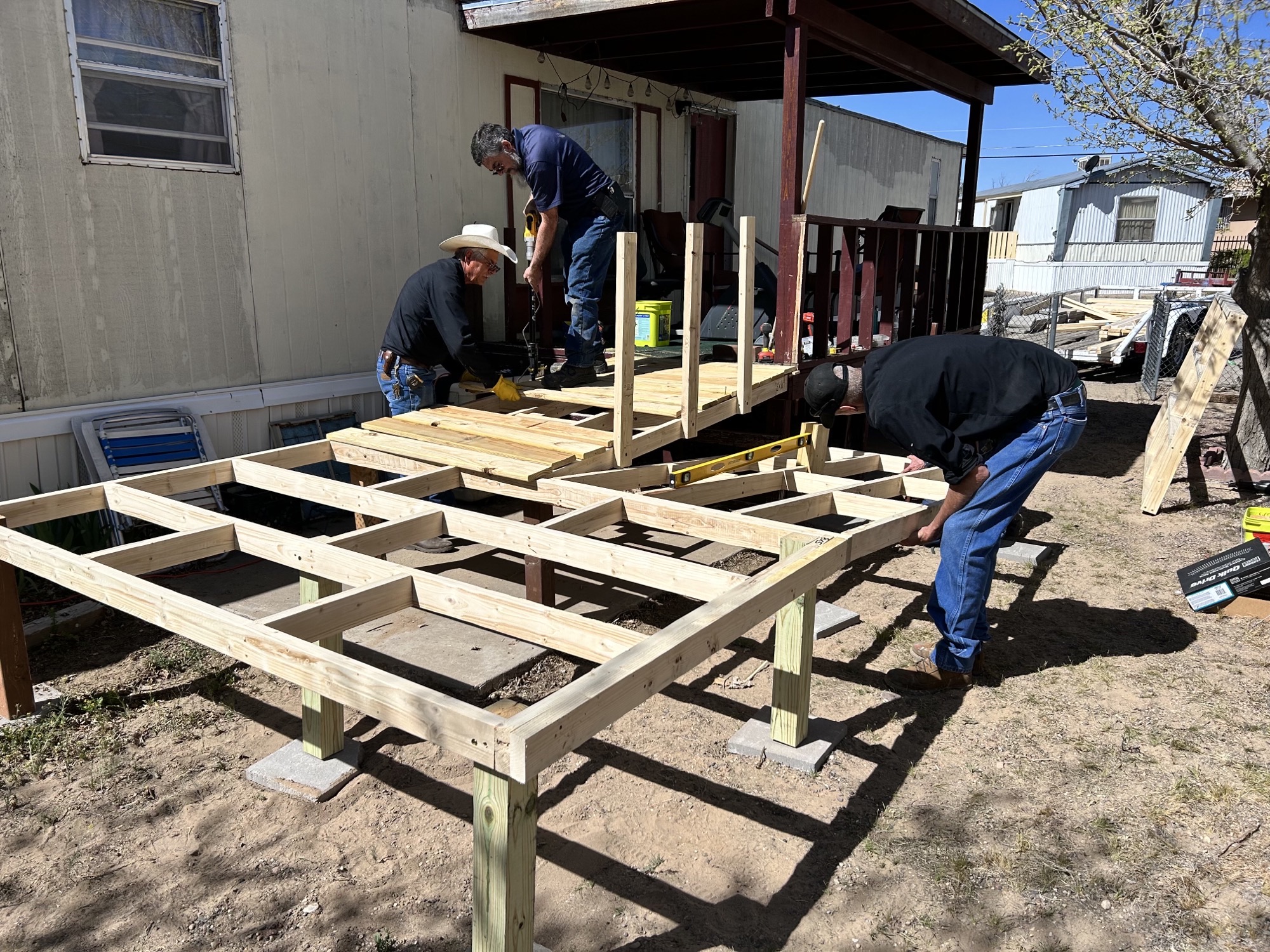 Blake's team members putting a ramp framework together