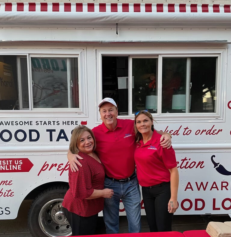 Blake's team members standing in front of a catering truck