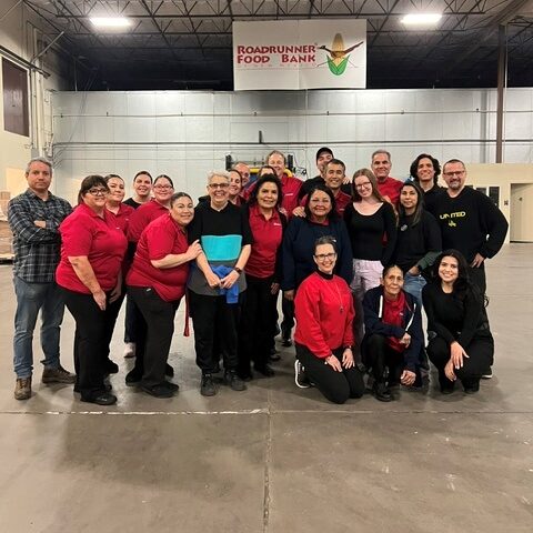 Group photo of Blake's team at road runner food bank