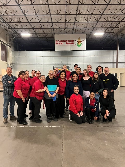 Group photo of Blake's team at road runner food bank