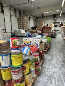 Image of food and non-perishable donations lined up