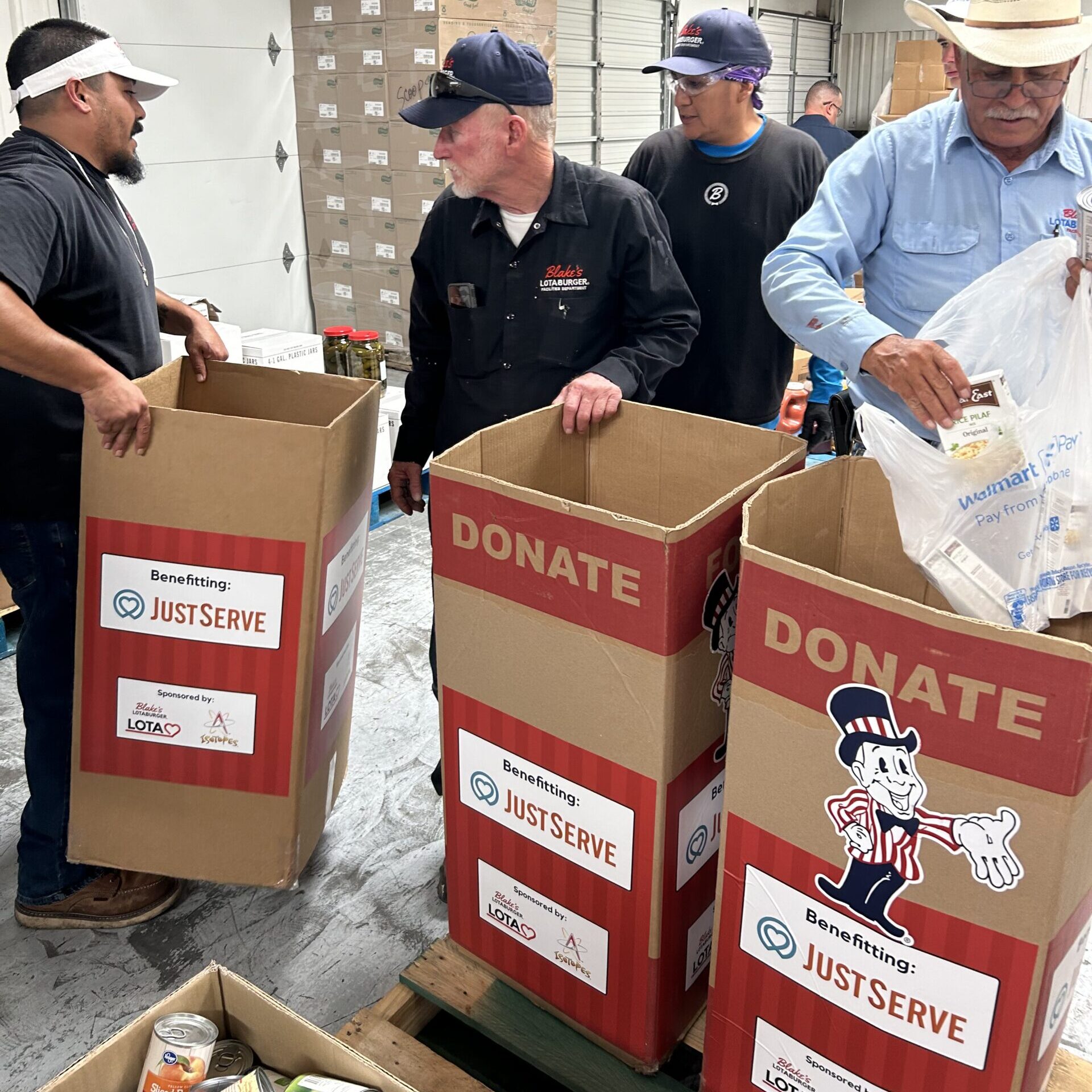 Team members from Blake's carrying and filling donation boxes.