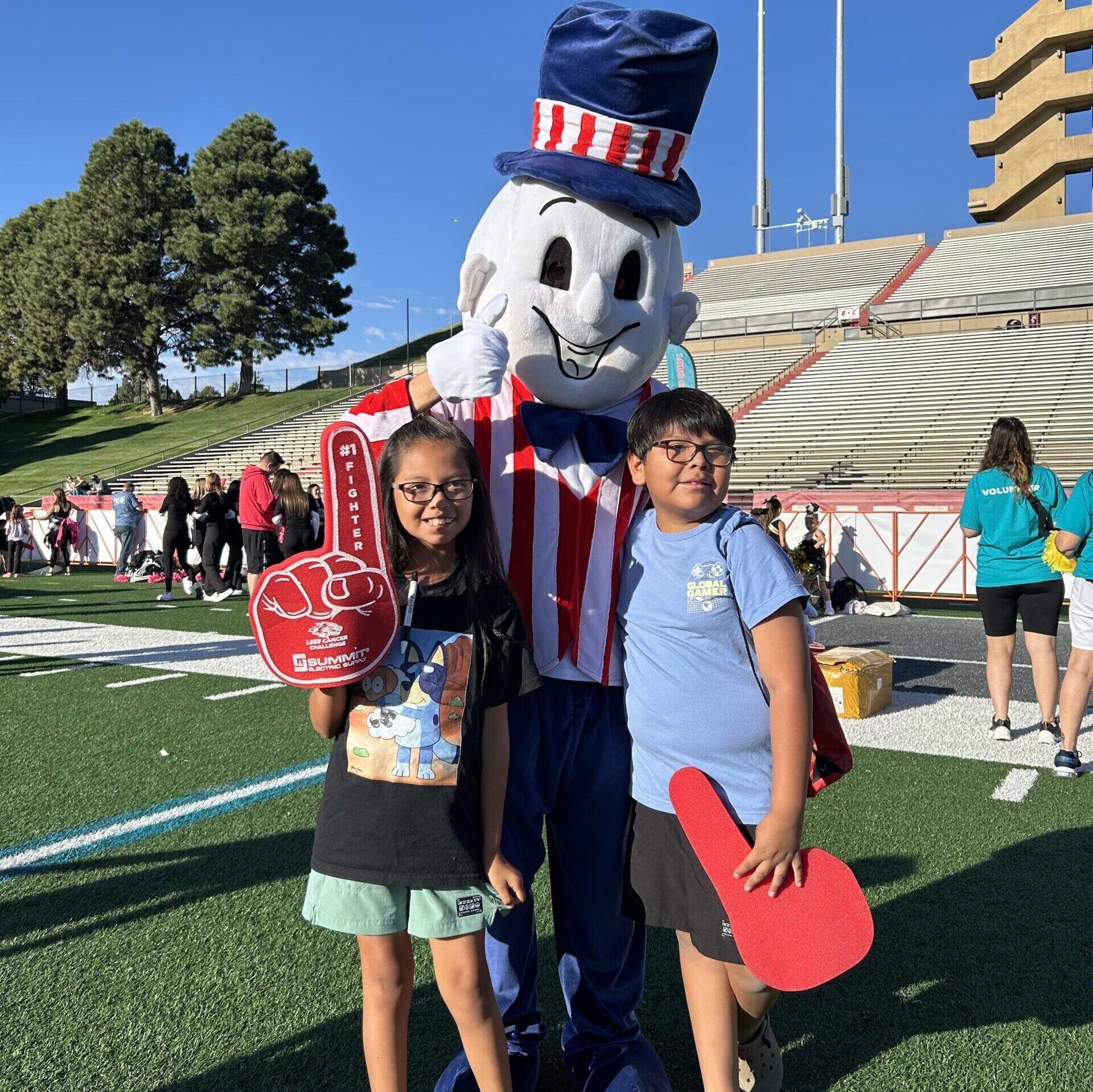 Blake's mascot with kids at University of New Mexico