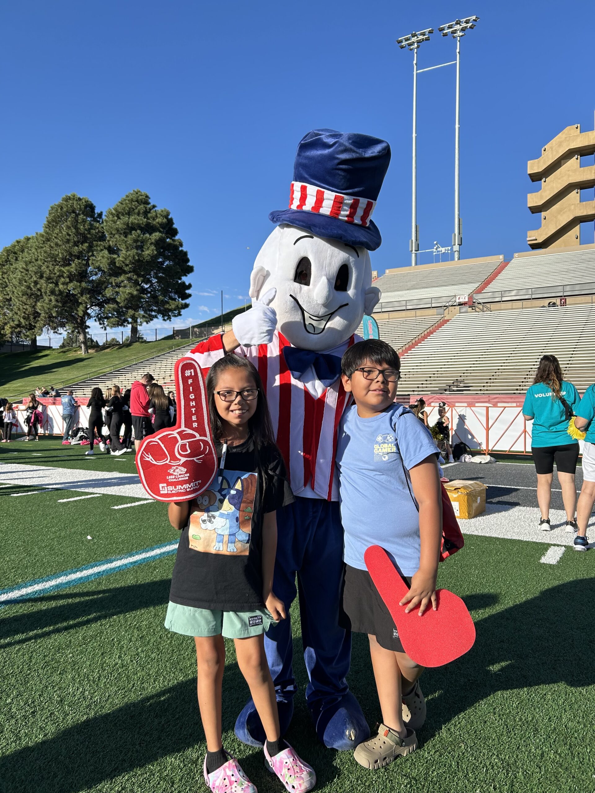Blake's mascot with kids at University of New Mexico