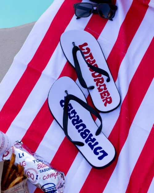 flip flops with the word lotaburger written on them in blue and red